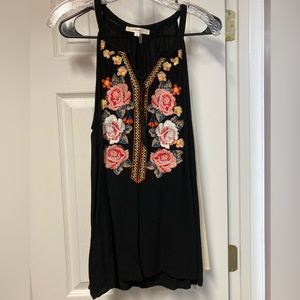 Boutique tanks. Size large. One black one ivory both with floral design.
